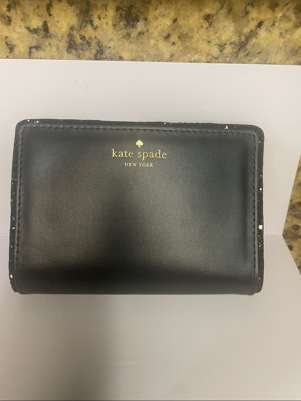 kate spade Black Leather Bifold Wallet with Gold Logo and sparkly trim